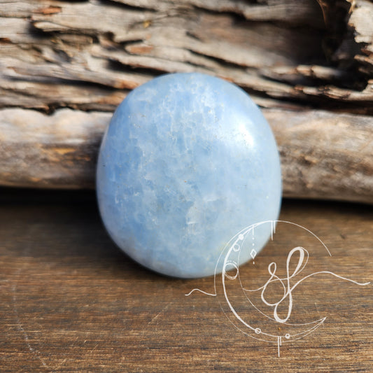 Celestite palm stone polished she fire