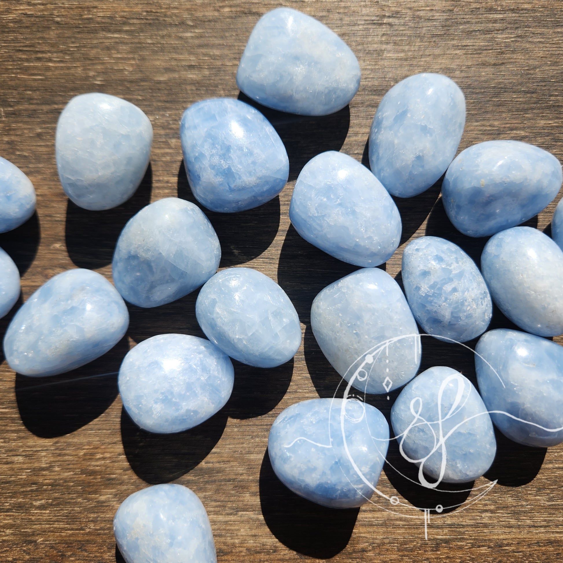 Blue calcite hand cut tumbles she fire