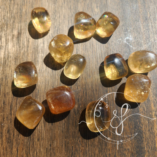 Hand cut golden rainbow yellow calcite she fire