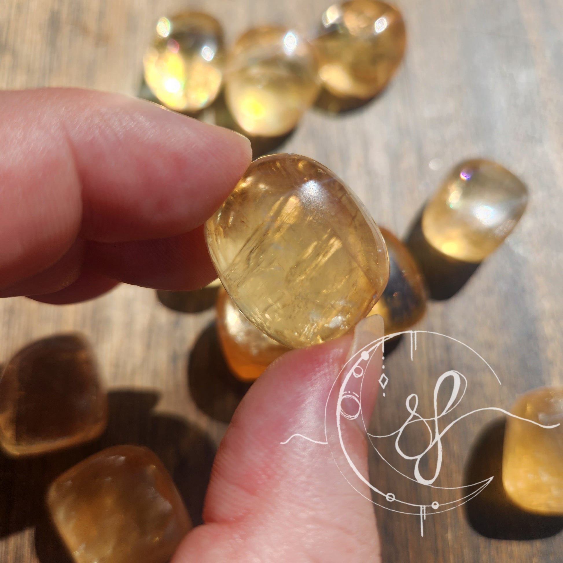 Hand cut golden rainbow yellow calcite she fire