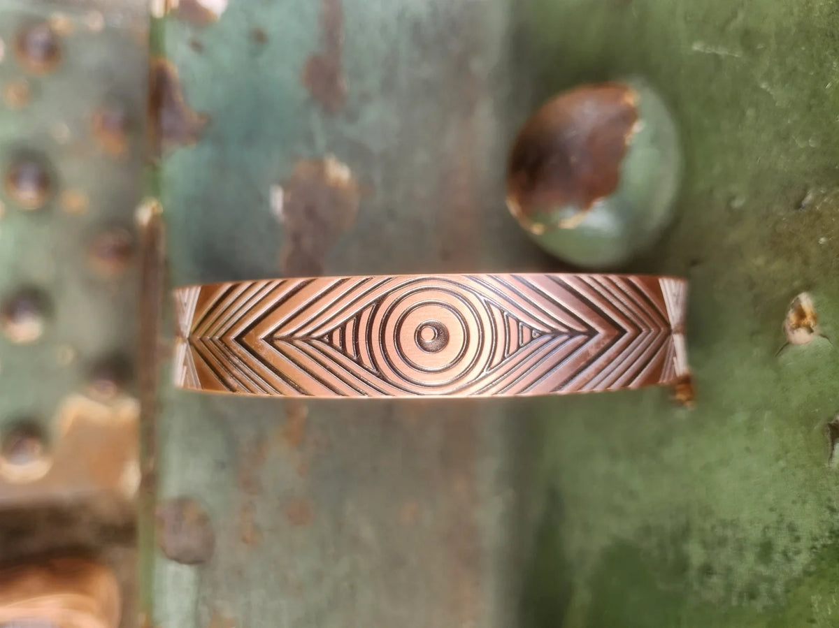 Detailed copper cuff bracelet geometric concentric circle motif