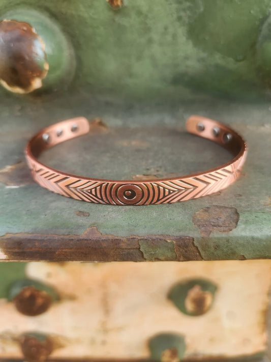 Front view of narrow concentric circle magnetic copper cuff