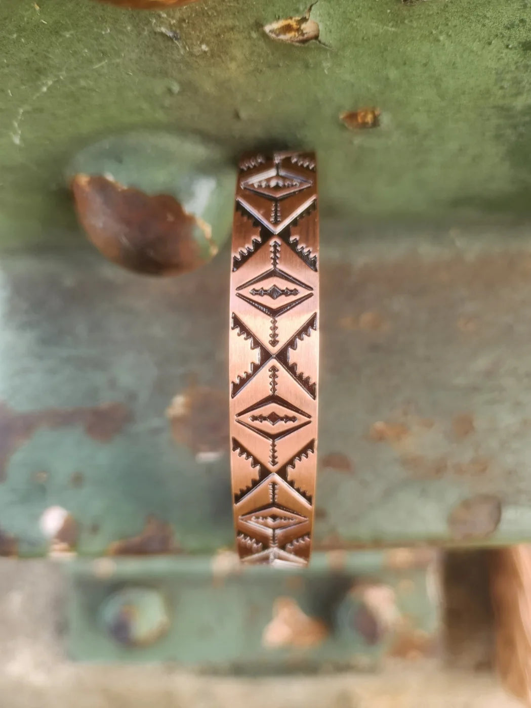 Close-up of patterned copper cuff